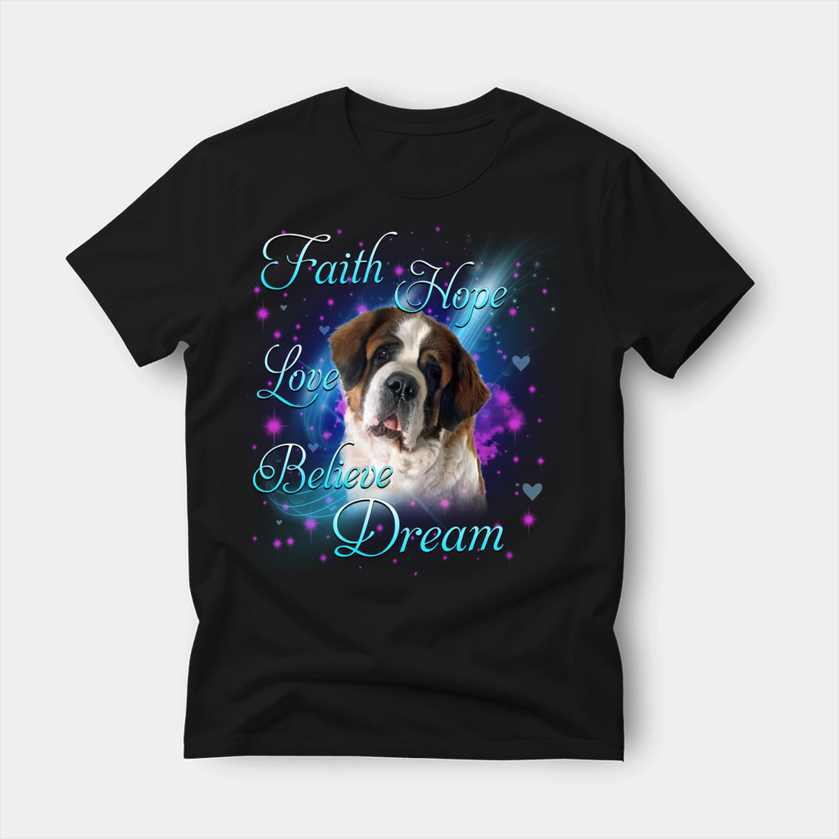 Black t-shirt printed with a Saint Bernard with the words Faith, Hope, Love, Believe and Dream in glowing script on a sparkling blue background