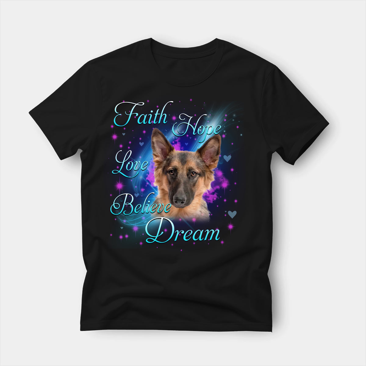 Black t-shirt printed with a German Shepherd with the words Faith, Hope, Love, Believe and Dream in glowing script on a sparkling blue background
