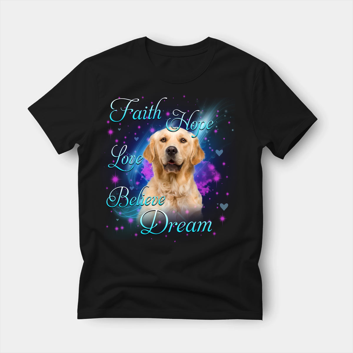 Black t-shirt printed with a Golden Retriever with the words Faith, Hope, Love, Believe and Dream in glowing script on a sparkling blue background