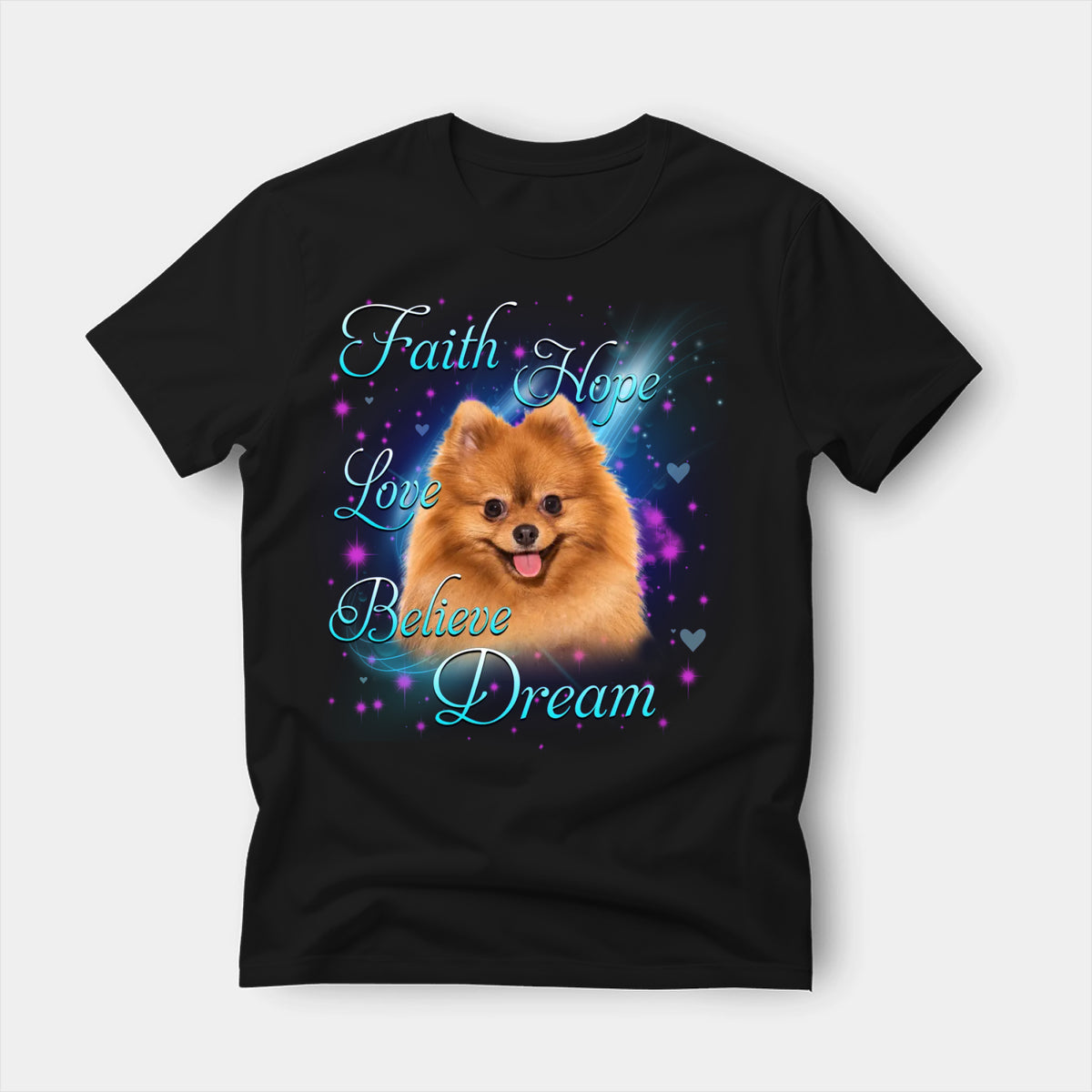 Black t-shirt printed with a Chow Chow with the words Faith, Hope, Love, Believe and Dream in glowing script on a sparkling blue background
