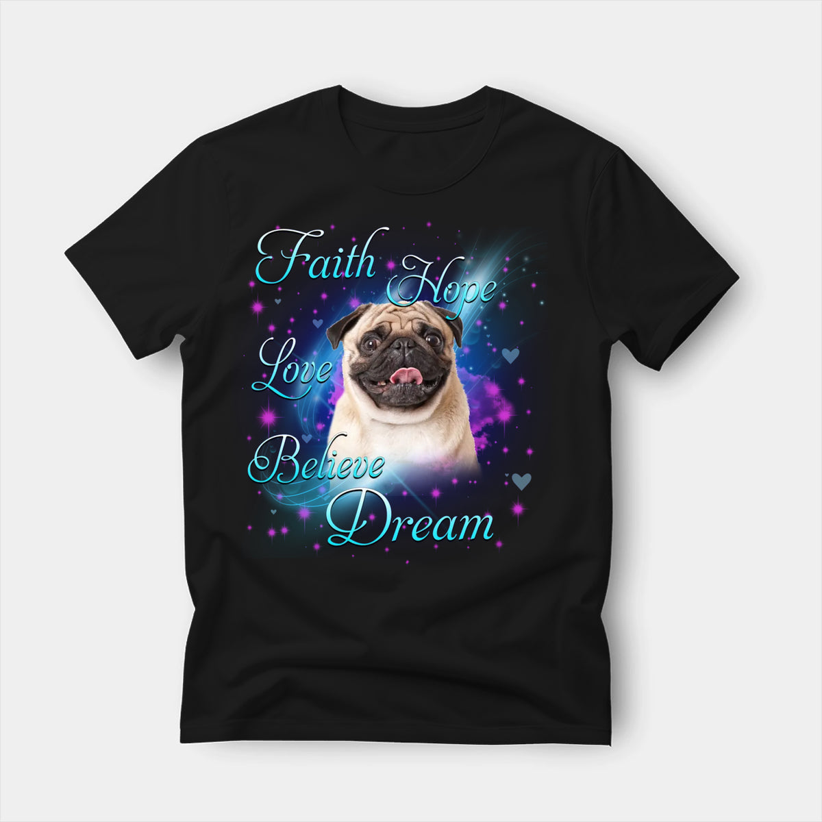 Black t-shirt printed with a Pug with the words Faith, Hope, Love, Believe and Dream in glowing script on a sparkling blue background