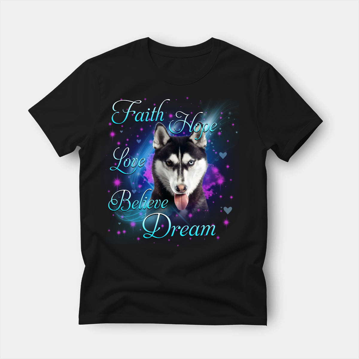 Black t-shirt printed with a Siberian Husky with the words Faith, Hope, Love, Believe and Dream in glowing script on a sparkling blue background