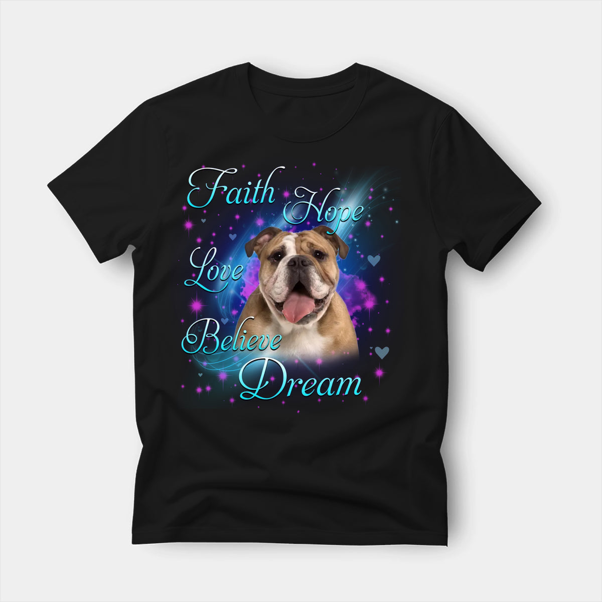Black t-shirt printed with an English Bulldog with the words Faith, Hope, Love, Believe and Dream in glowing script on a sparkling blue background