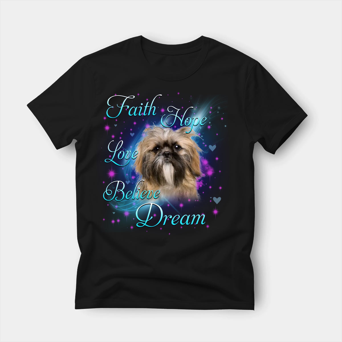 Black t-shirt printed with a Shih Tzu with the words Faith, Hope, Love, Believe and Dream in glowing script on a sparkling blue background