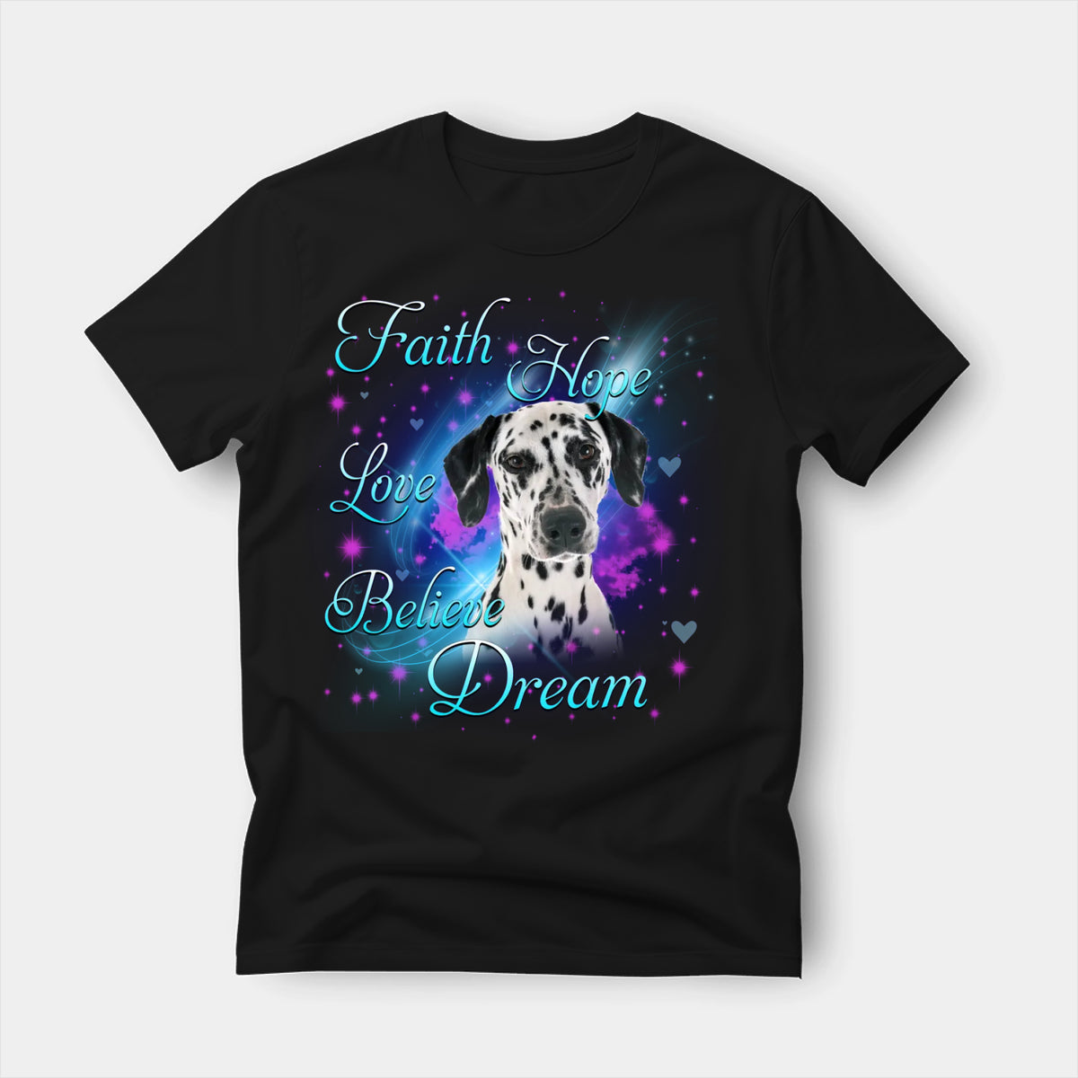 Black t-shirt printed with a Dalmatian with the words Faith, Hope, Love, Believe and Dream in glowing script on a sparkling blue background
