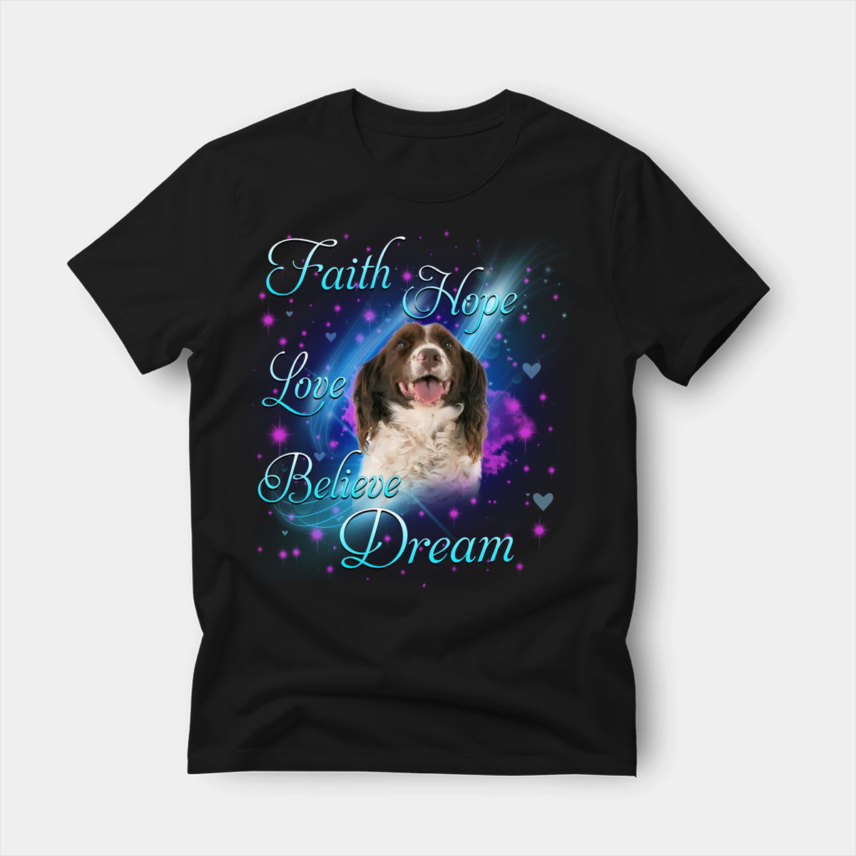 Black t-shirt printed with an English Springer Spaniel with the words Faith, Hope, Love, Believe and Dream in glowing script on a sparkling blue background